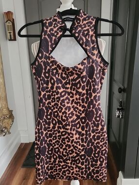 PrettyLittleThing Black and Tan Leopard Print Cutout Dress